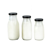 wholesale 200ml round milk juice glass bottles with screw metal cap